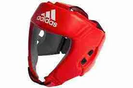 Red Adidas IBA Approved boxing headgear by Proamboxinguk with padded protection and adjustable straps designed for competition use.