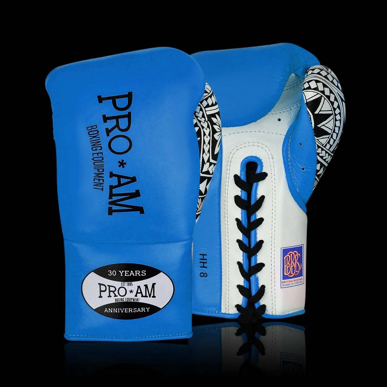 Proamboxinguk Valero professional boxing gloves with BBBofC approval, showing black and red padded gloves for training or competition