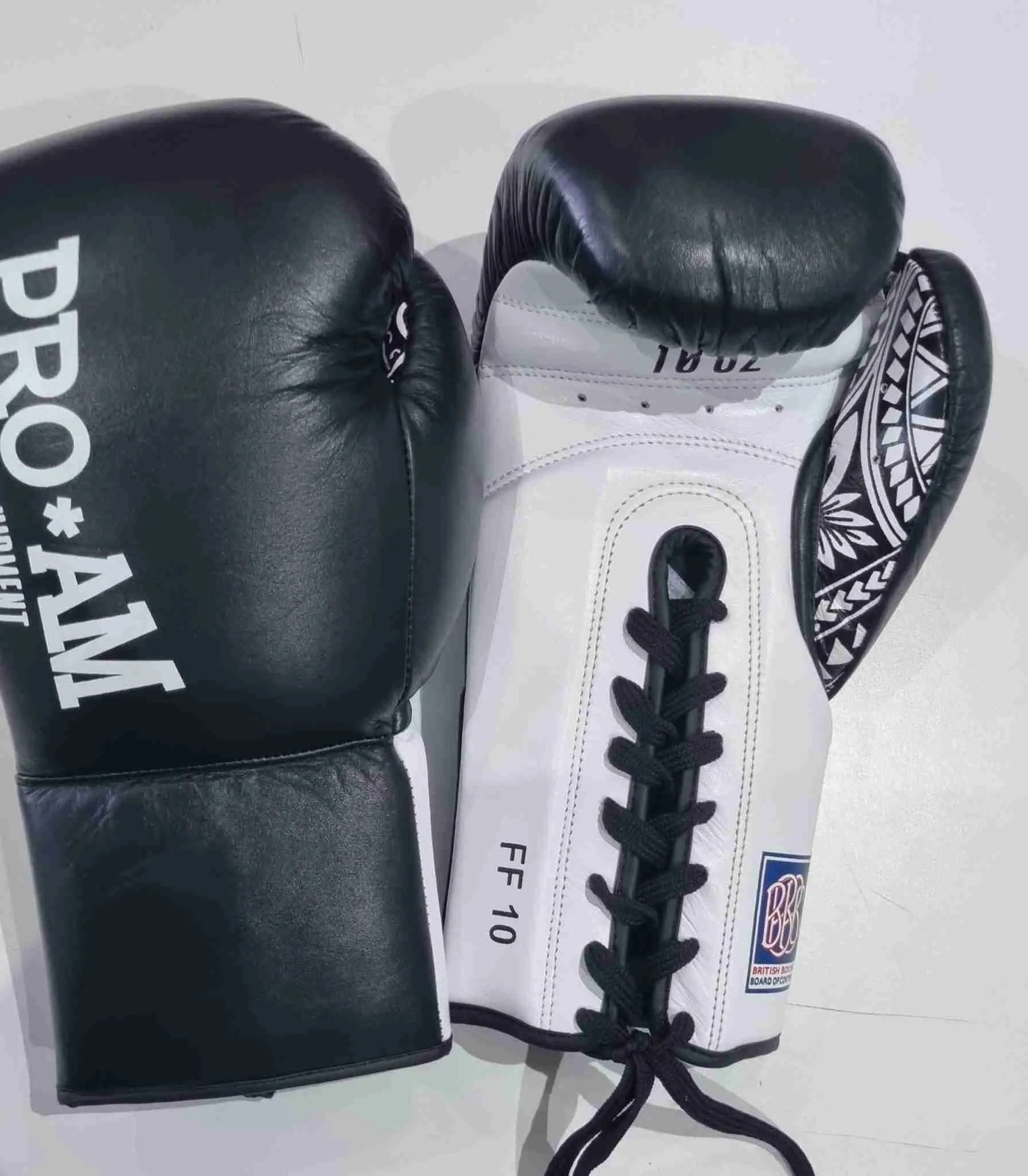 Pro-Am Undisputed professional boxing gloves by Proamboxinguk with BBBofC approval, padded for training and competition use.