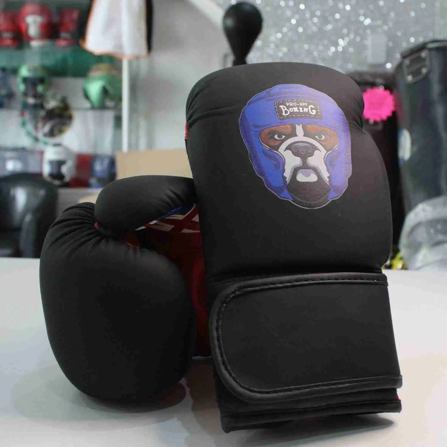 Kids boxing gloves by Proamboxinguk, lightweight and padded for children’s training and boxing practice.