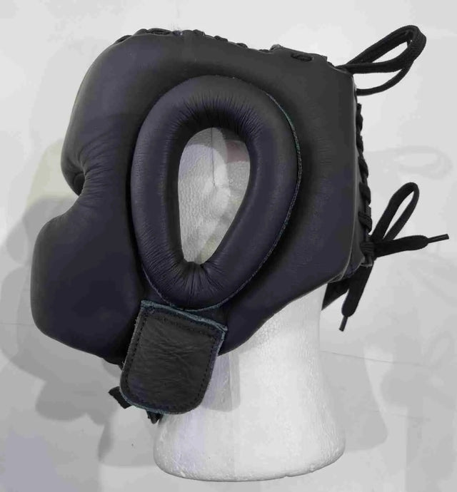 Pro-Am V-Shadow professional boxing headguard showing padded headgear with adjustable straps and branding details.