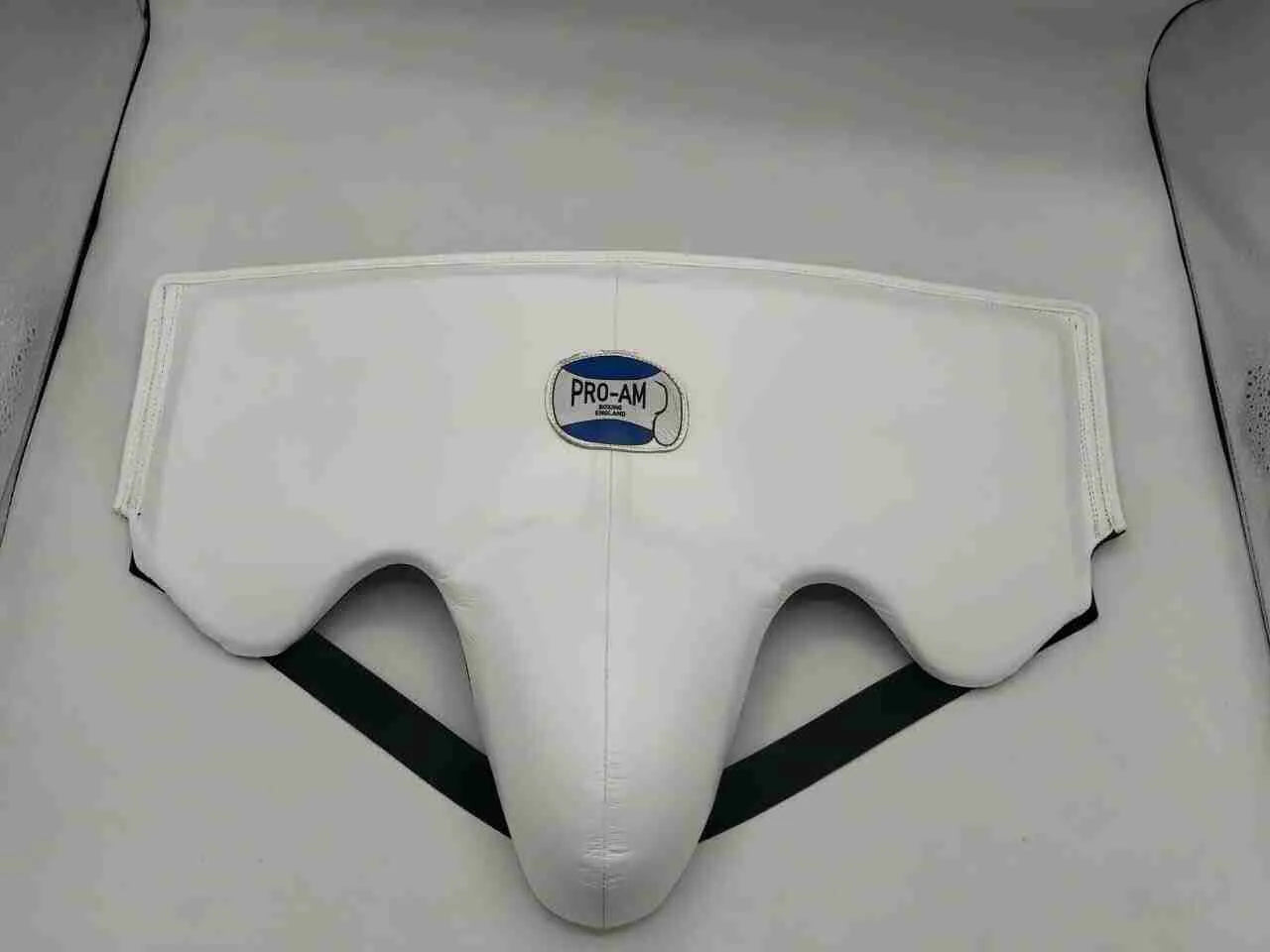 Pro-Am No Foul abdominal guard and groin protector for boxing, black protective gear with adjustable straps, by Proamboxinguk.