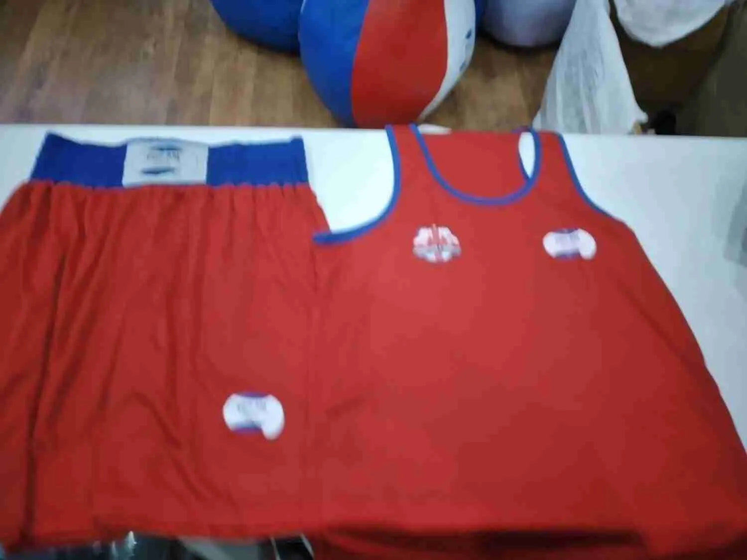 Custom Proamboxinguk boxing shorts and vest with logo, designed for club training and competitions.