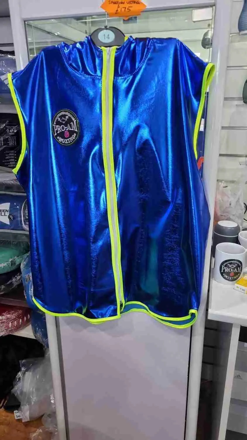 Custom boxing shorts by Proamboxinguk with personalized name and logo, featuring vibrant colors and a comfortable fit.