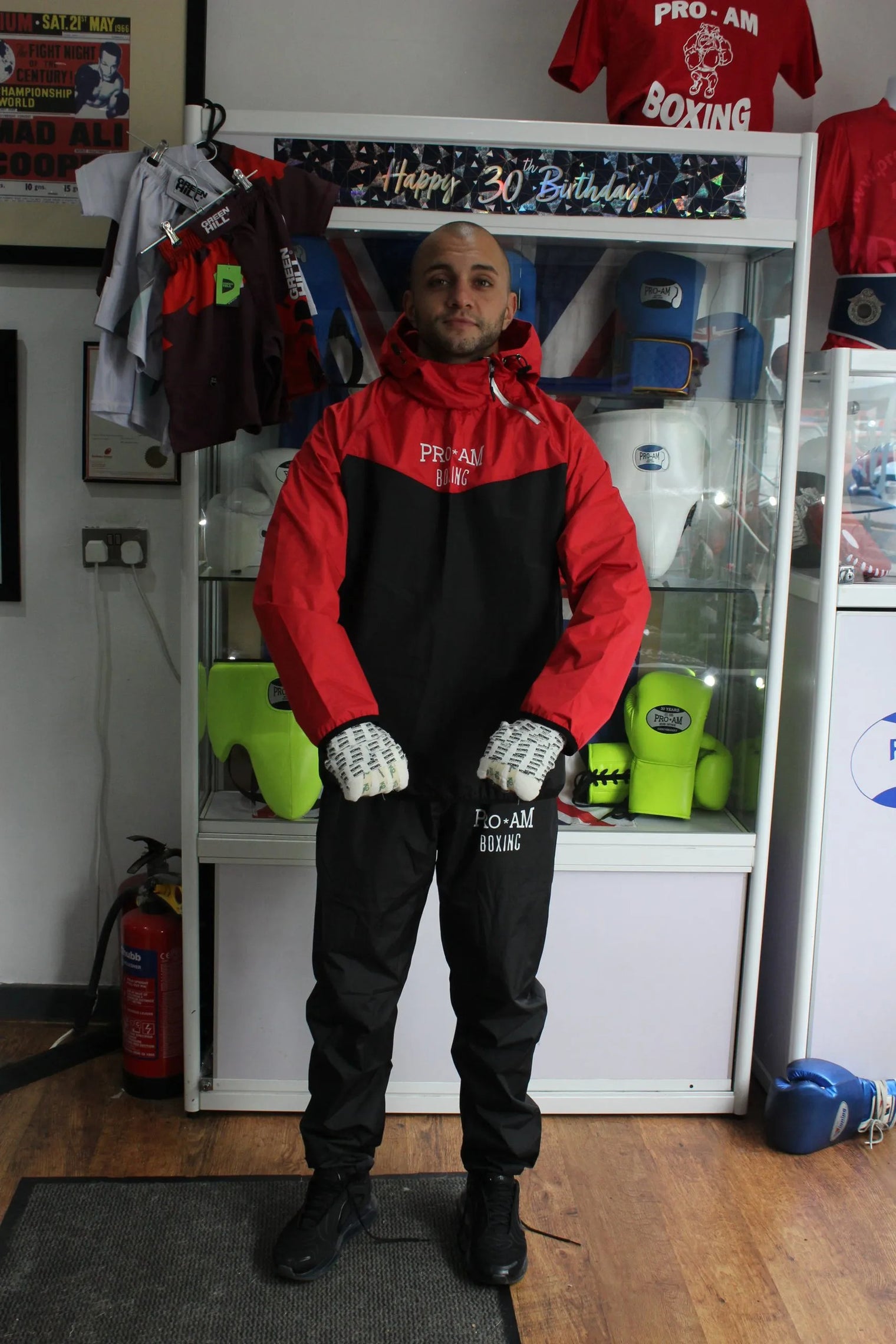 Pro-Am Sauna Suit by Proamboxinguk, full-body weight loss training suit shown on mannequin. Black, lightweight, full coverage.