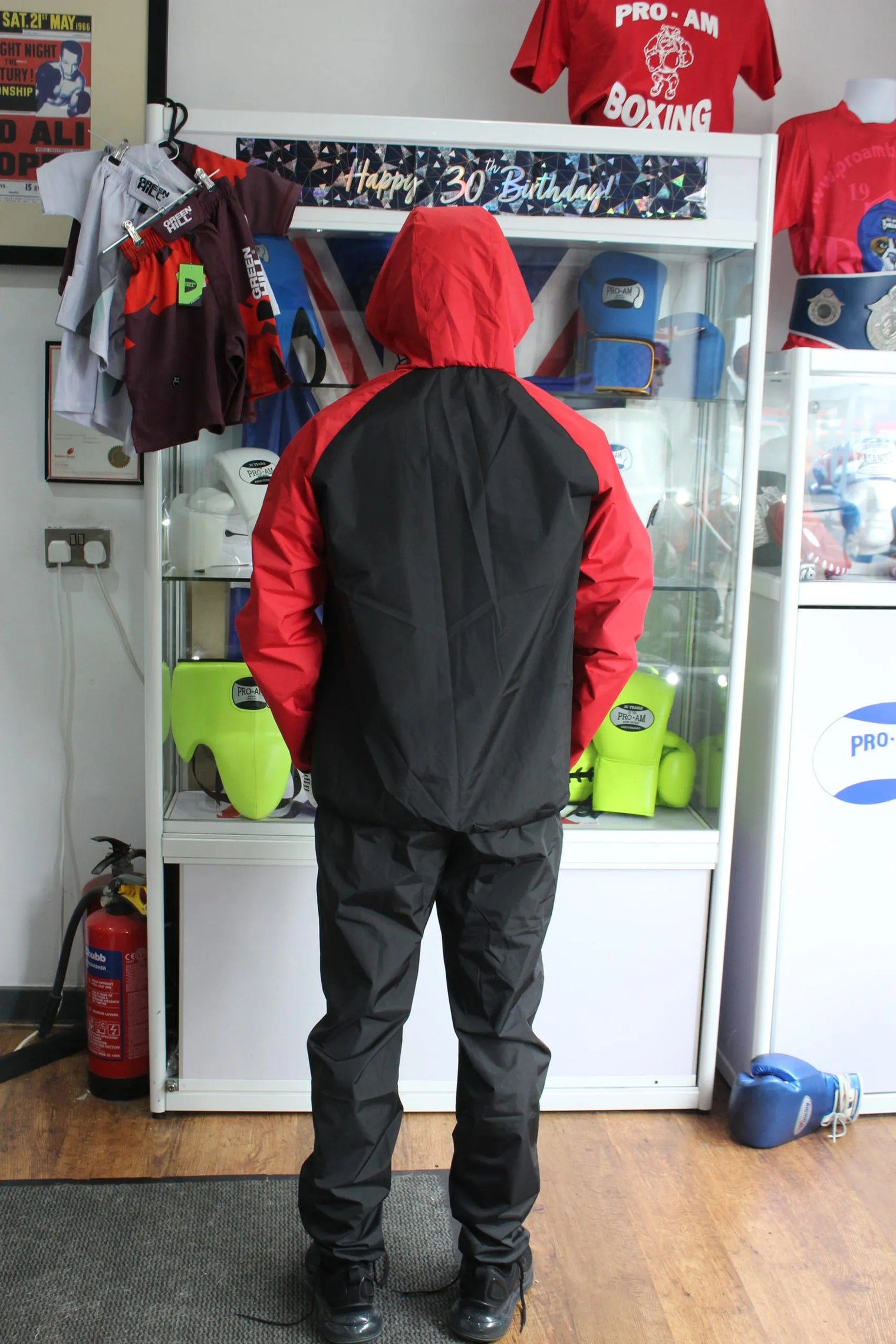 Full body Pro-Am Sauna Suit for weight loss training, showing the lightweight, full-body design and adjustable straps.