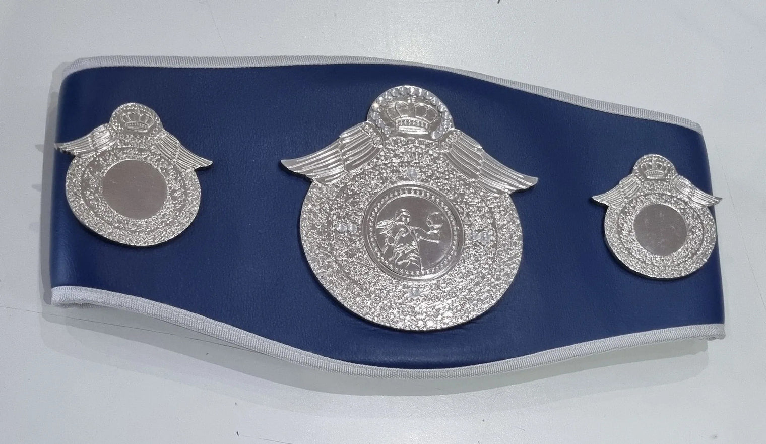 Pro-Am Champions boxing belt with custom award design, featuring a shiny gold plate and black leather strap by Proamboxinguk.