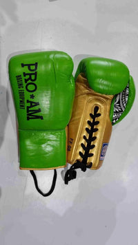 Pro-Am Undisputed professional boxing gloves by Proamboxinguk, BBBofC approved, showing black gloves with padded wrists and branding.