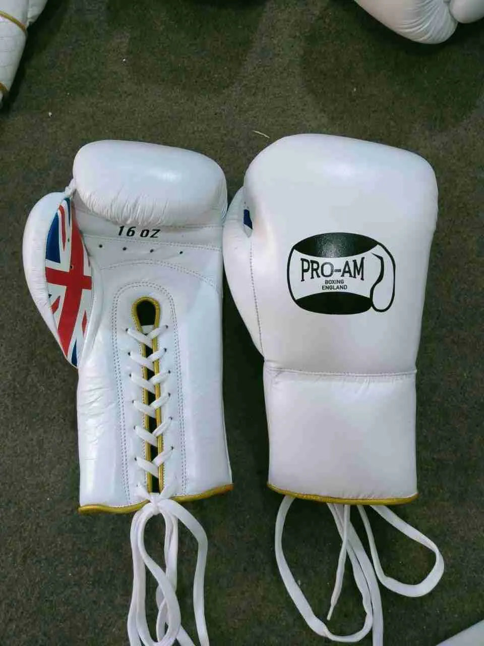 Pro-Am Professional Sparring Boxing Gloves by Proamboxinguk, lace-up design, padded for training and fight protection.