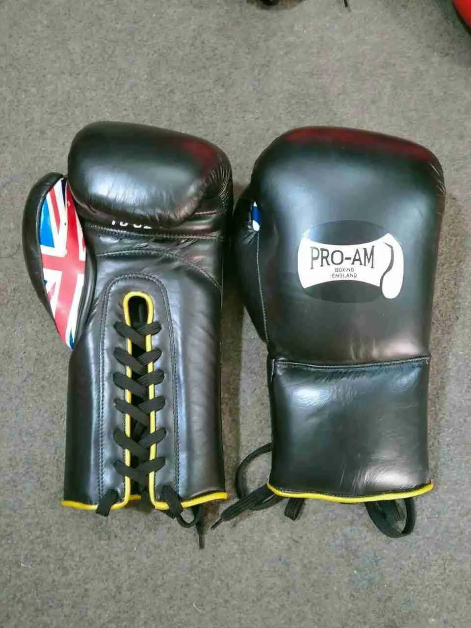 Pro-Am Professional Sparring Boxing Gloves by Proamboxinguk, lace-up design with padded wrists for boxing training and sparring.