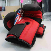 Kids boxing gloves by Pro-Am Kids Boxing Gloves, black and red, with padded wrist support and brand logo visible.