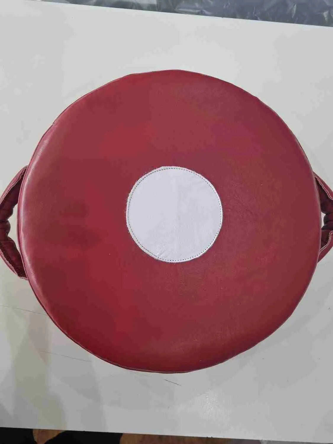 Medium Mexican leather punch shield for boxing, 35cm, by Proamboxinguk, showing padded surface and handles for training.