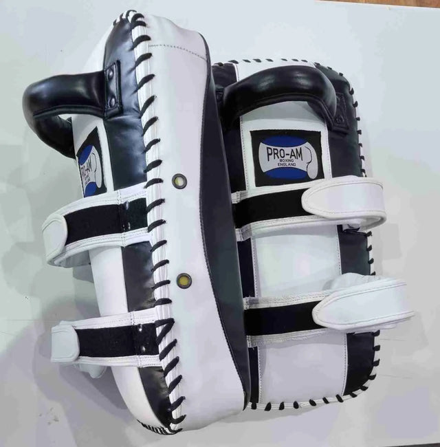 Pro-Am Thai Kick Pads for boxing training, featuring durable padding and adjustable straps by Proamboxinguk.