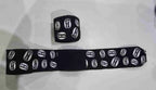 Pro-Am Stretch Boxing Hand Wraps by Proamboxinguk, showing black and white elastic hand wraps for boxing training and protection.