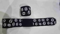 Pro-Am Stretch Boxing Hand Wraps by Proamboxinguk, showing black and white elastic hand wraps for boxing training and protection.