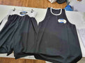 Custom Proamboxinguk boxing shorts and vest with logo, displayed in a boxing kit set for training or competition.