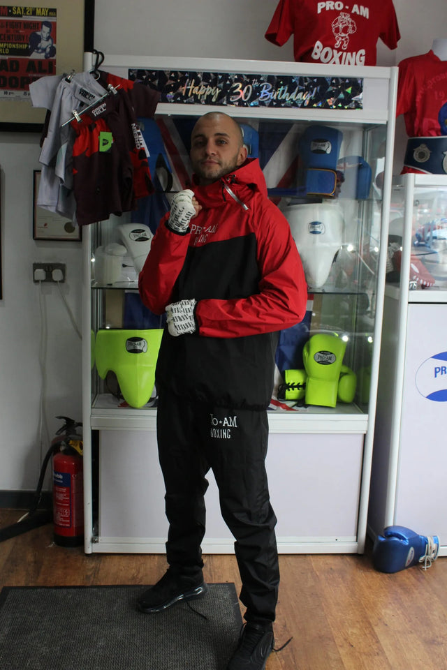 Pro-Am Sauna Suit by Proamboxinguk, full body weight loss training suit, black fabric with adjustable straps, worn for exercise.