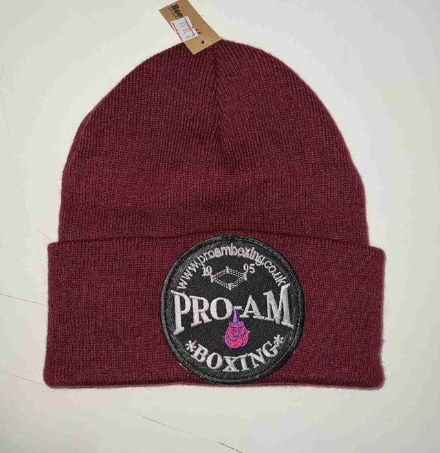 Pro-Am Boxing Beanie Hat by Proamboxinguk, soft knit fabric, black color, close-up view showing the branded logo and cozy fit.