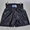 Pro-Am Satin Boxing Shorts in black with white trim, featuring the Proamboxinguk logo and comfortable waistband.