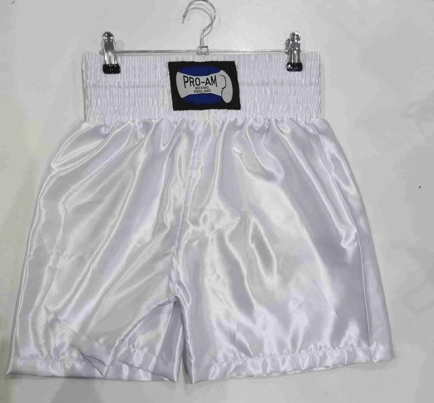 Pro-Am Satin Boxing Shorts in black with white trim, featuring the Proamboxinguk logo, designed for boxing training and matches.