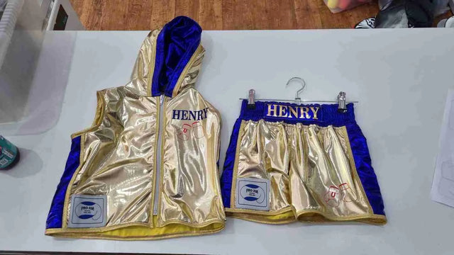 Custom adult boxing ring shorts and jacket set by Proamboxinguk, featuring athletic fabric and vibrant design for boxing training and matches.