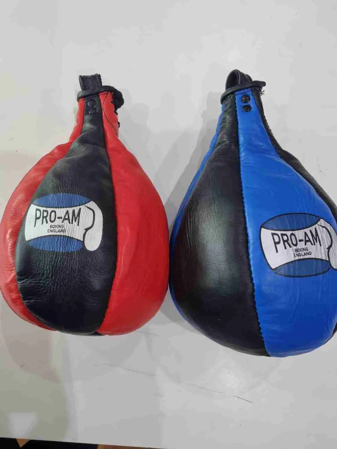 Pro-Am Slip Bags boxing reflex training bag, black and red boxing equipment with handles for boxing reflex drills.