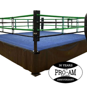 Custom boxing rings by Proamboxinguk with padded corner posts and blue canvas surface for professional boxing matches.