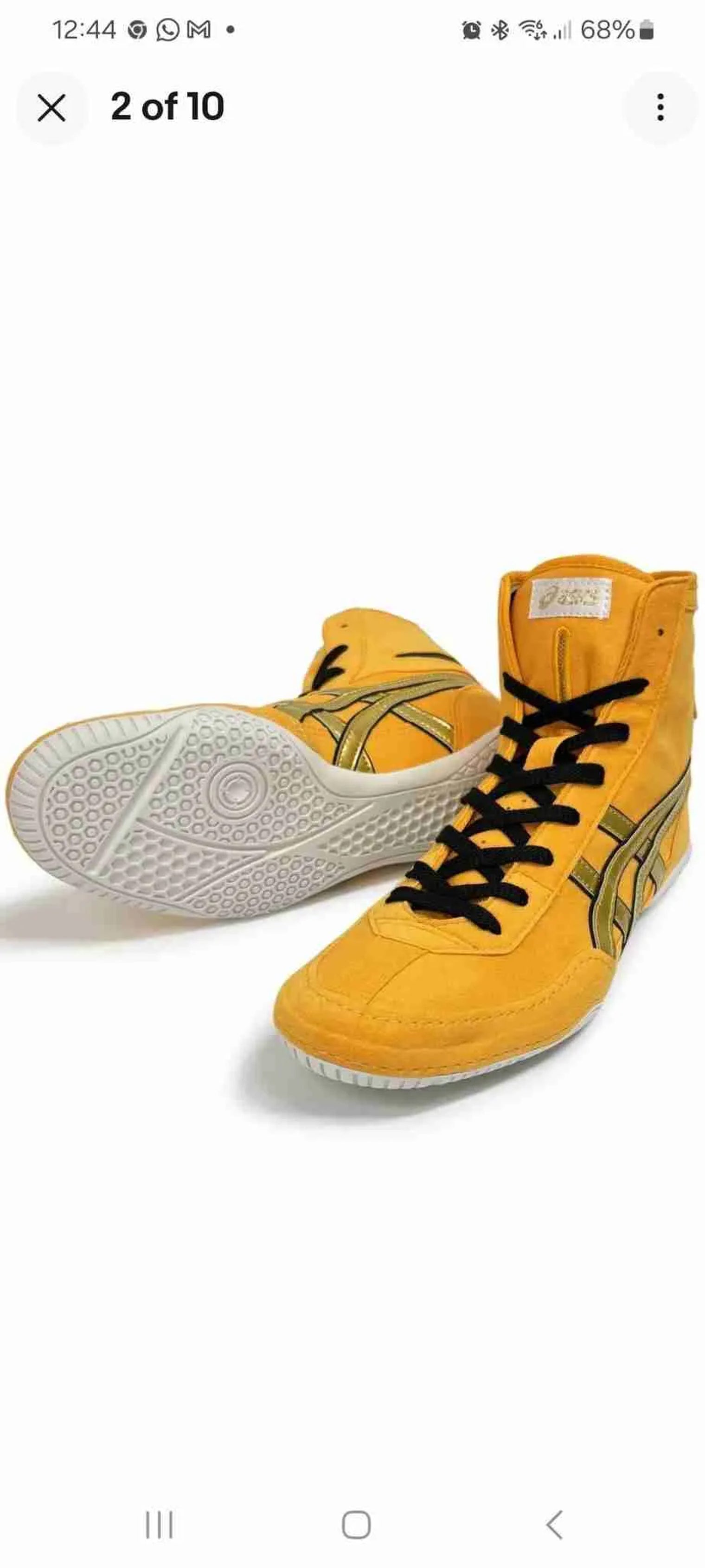 Asics boxing boots in various colors, displayed on a plain background, showcasing the full range of custom-made boxing footwear.