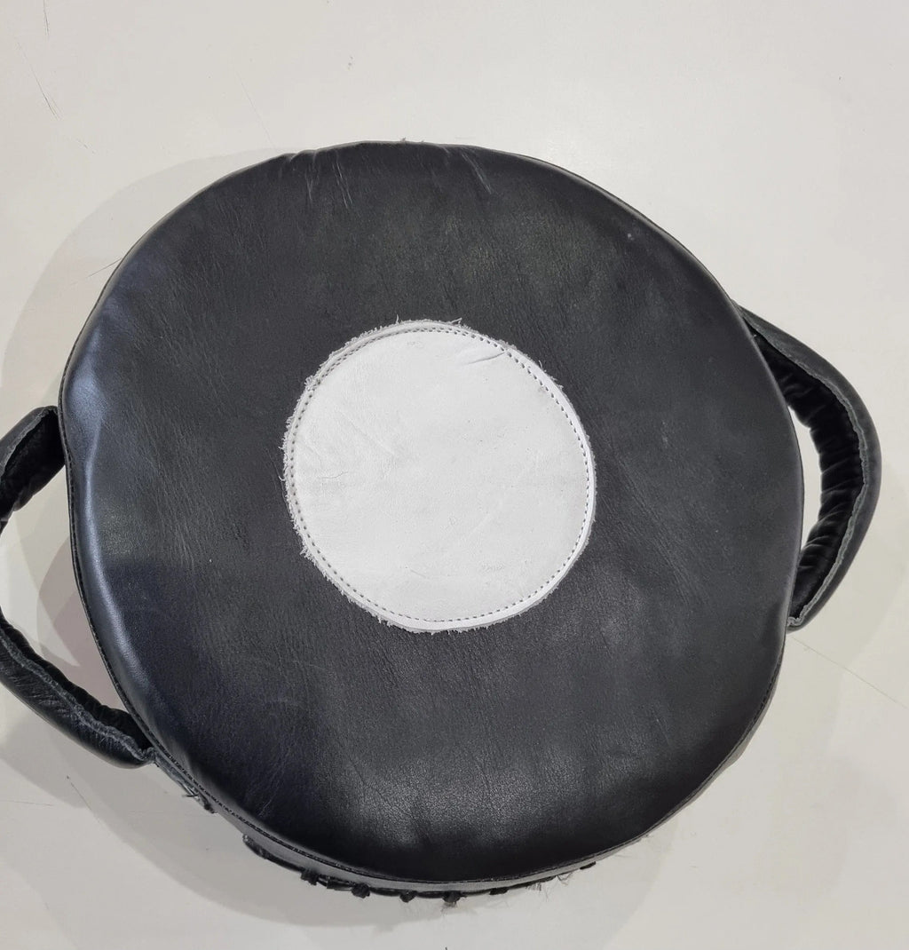 Small Mexican leather punch shield by Proamboxinguk, featuring durable leather construction and padded handle for boxing training.