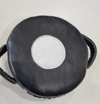 Small Mexican leather punch shield by Proamboxinguk, featuring durable leather construction and padded handle for boxing training.