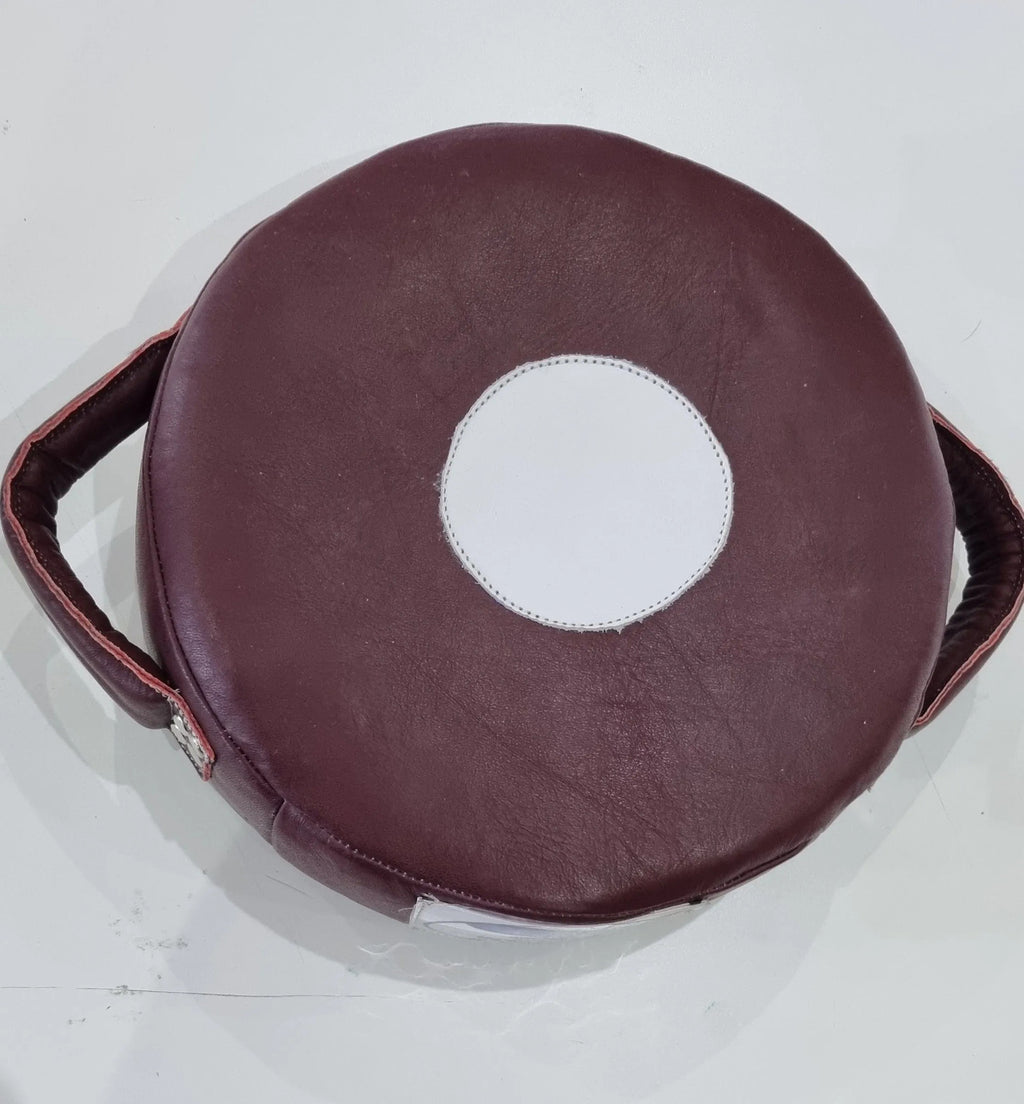 Small Mexican leather punch shield by Proamboxinguk showing sturdy leather construction and padded handles for boxing training.