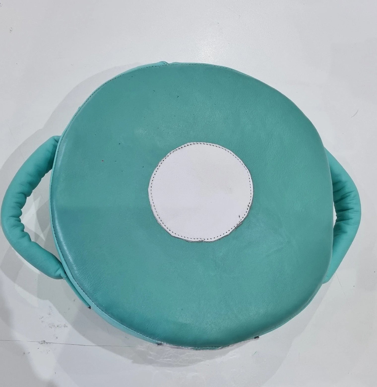 Small Mexican leather punch shield by Proamboxinguk, featuring sturdy leather construction and padded handles for boxing training.