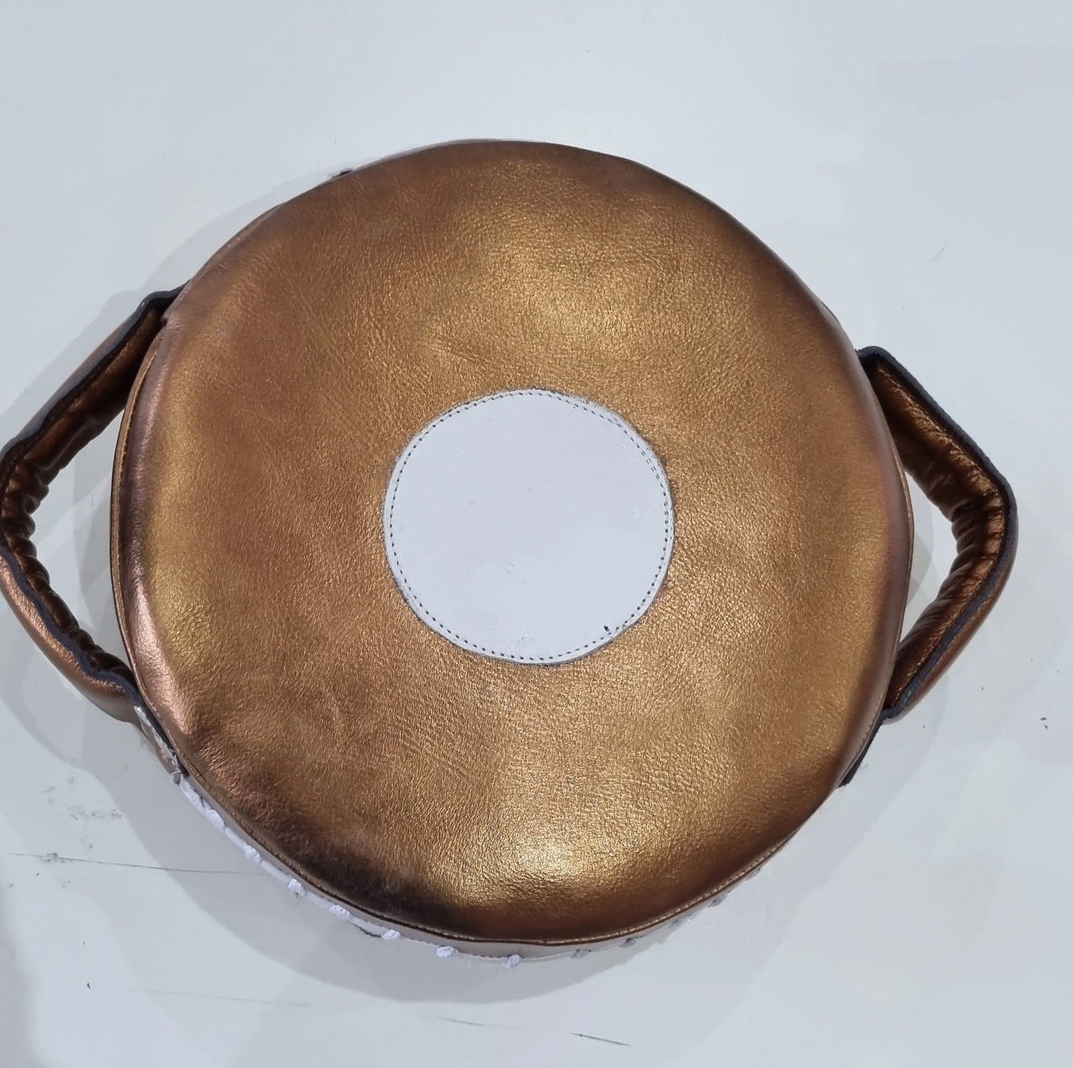 Small Mexican leather punch shield by Proamboxinguk featuring durable leather and padded handles for boxing training.